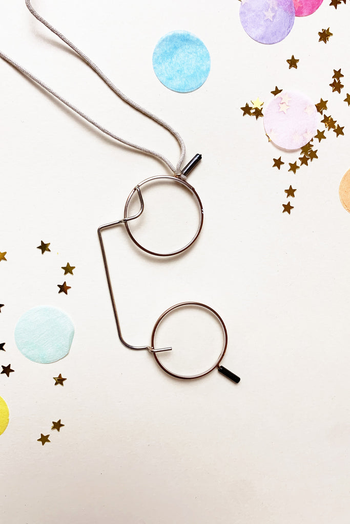 Collana lenti rotonde cordino ecrù